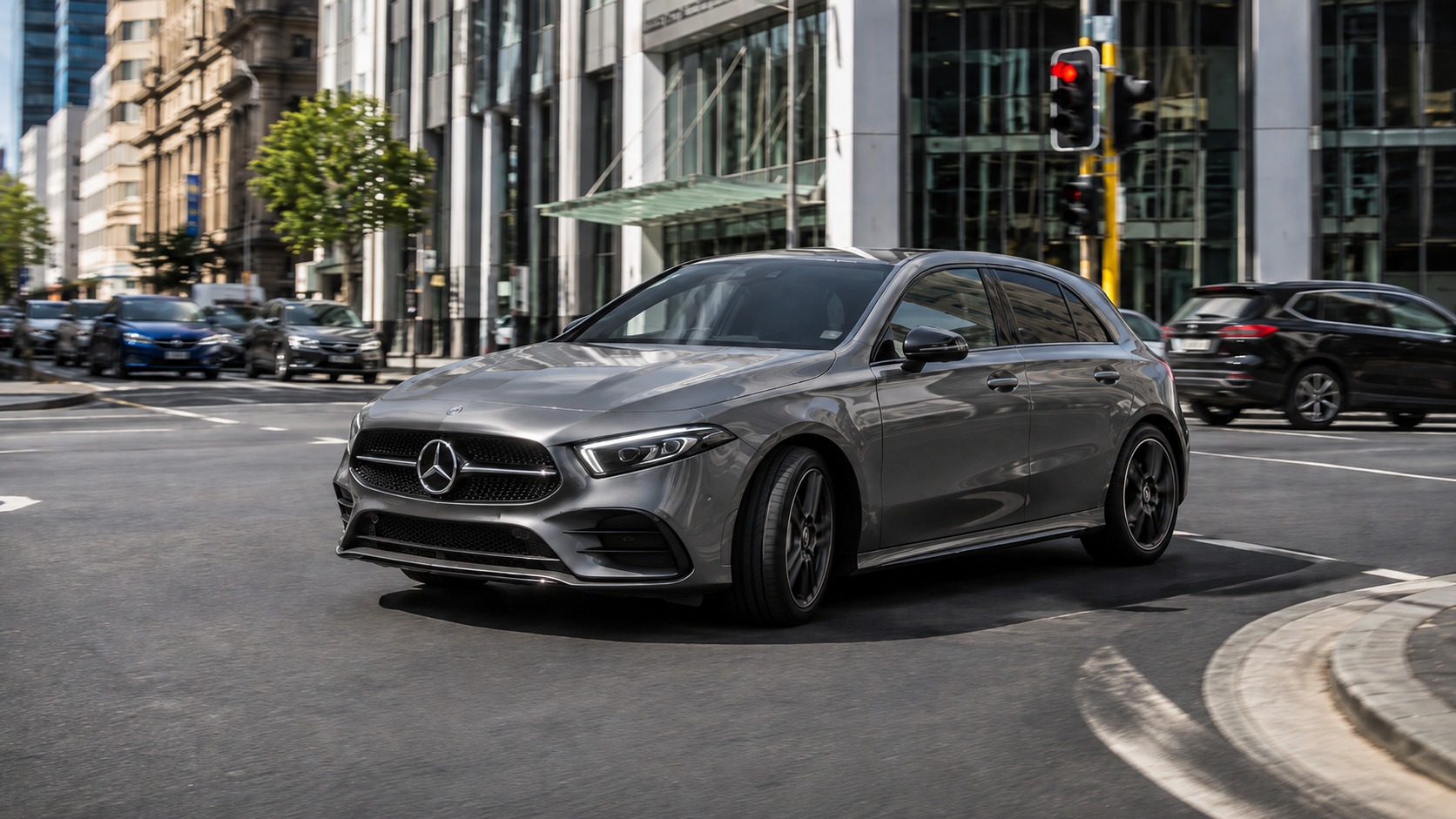 A late-model grey hatchback on a city street, illustrating how quickly new cars lose value.